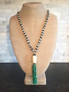 Brown and white bone necklace with beaded tassel