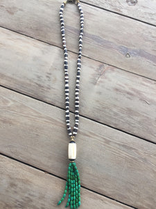 Brown and white bone necklace with beaded tassel